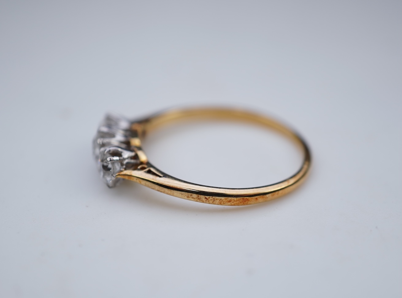 A three-stone diamond ring, early 20th century